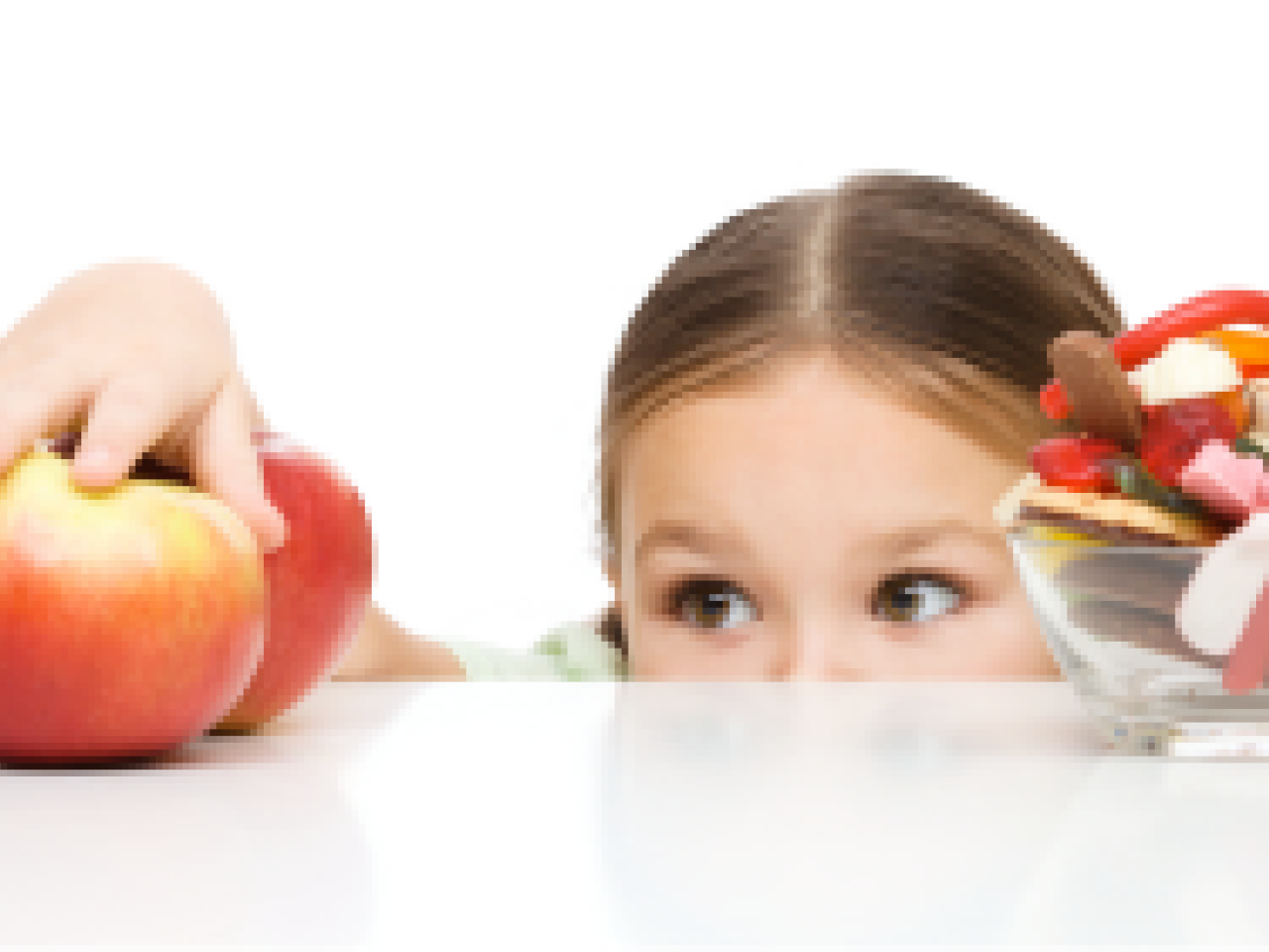 Child reaching for apples instead of candy